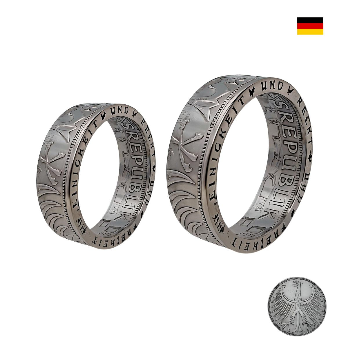 Detailaufnahme von einzigartigen Münz-Partnerringen mit individueller Gravur – Symbol für Liebe und Verbundenheit